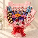 Pink chocolate bouquet with Raffaello, Ferrero Rocher, Bounty, roses and daisies