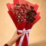 Scarlet Indulgence bouquet with 10 KitKat chocolates 10 red roses and Gypsophila