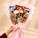 Sweet Snack Charm bouquet with Frisky wafers chocolates biscuits and snacks in pink wrapping